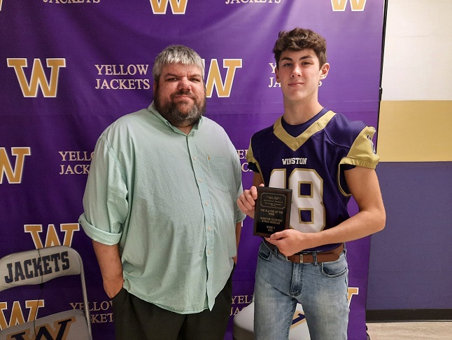 Morgan receives POTW plaque